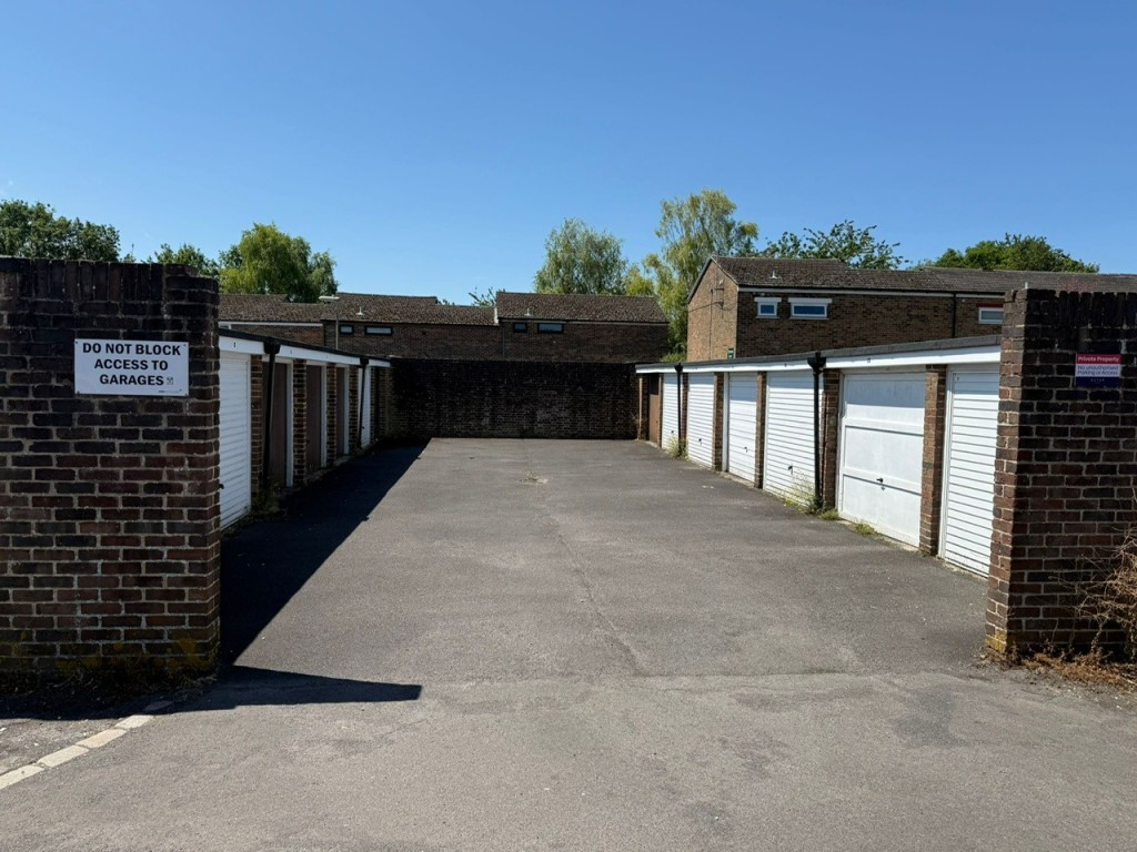 Lot: 27 - NINE LOCK-UP GARAGES - View of the entire block of garages